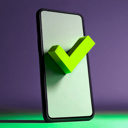 A smartphone displaying a green checkmark, representing a human-verified and defensible digital training record.