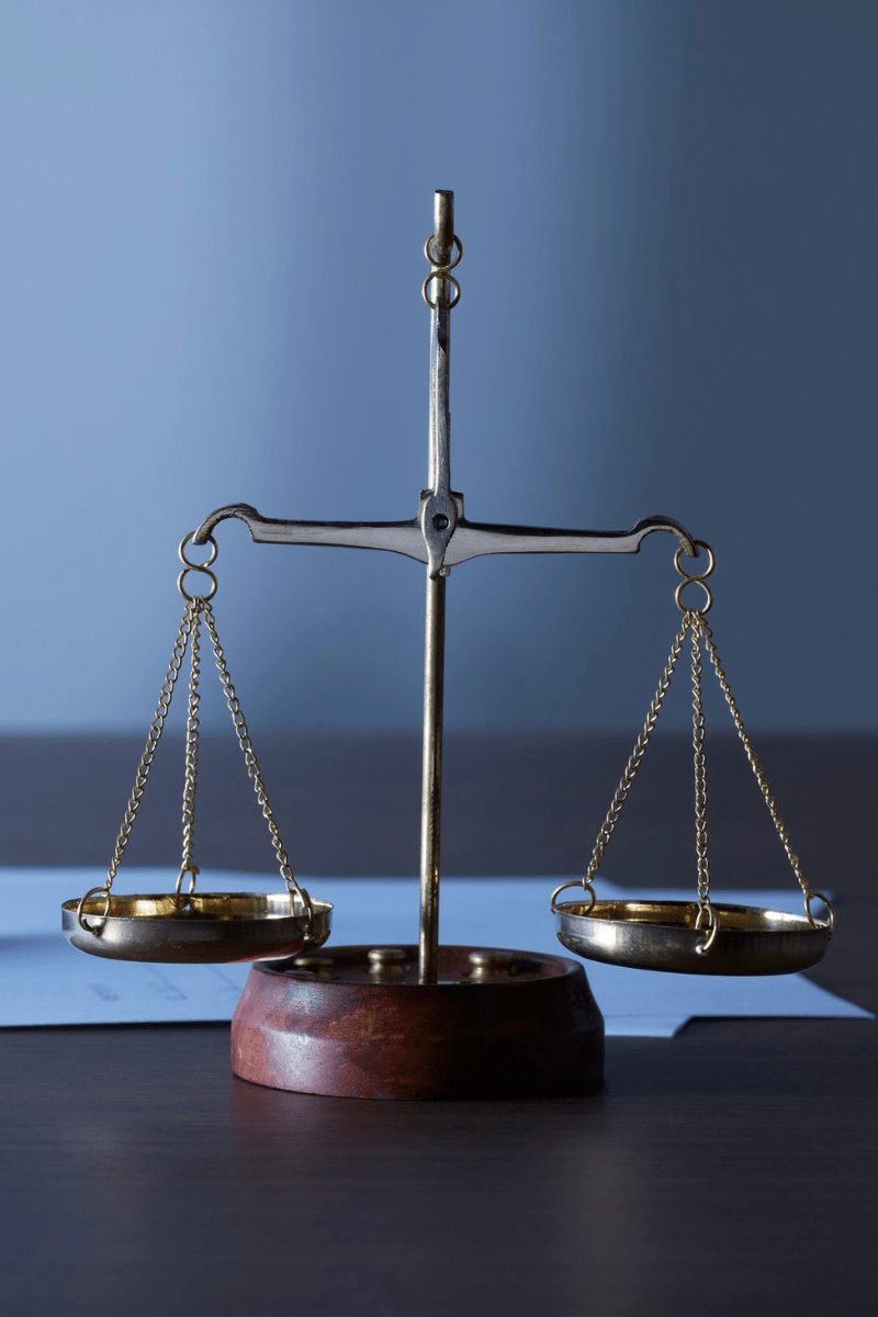 A set of scales, symbolising the balanced approach of human-led examination invigilation.